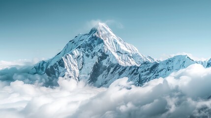 A majestic mountain peak covered in snow, standing tall above the clouds
