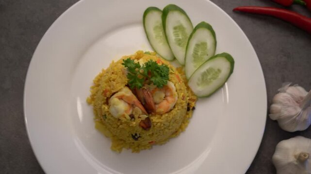 Tasty fried rice with vegetables served on the concrete table