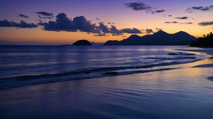 Naklejka premium Calm Beach at Sunset Reflecting Sky with Distant Mountain View
