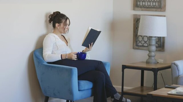 In a cozy corner, she immerses herself in a gripping novel, surrounded by soft lighting.