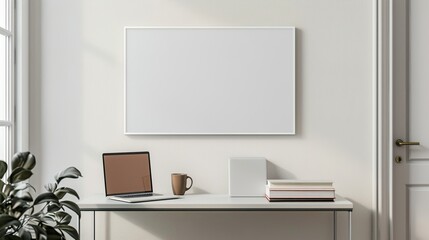 A white rectangular frame in a hallway above a table with a cup, a laptop, and a couple of books. HD 8K mockup wallpaper Photographic Image