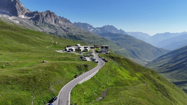 Flight with panorama view of mountain pass Furka Pass serpentine road in the Swiss Alps, Switzerland