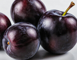 Fototapeta premium Close-Up of Fresh Black Plums with Glossy Skin