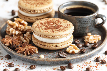 Fototapeta premium A delicious arrangement of macarons, walnuts, and coffee on a rustic plate, creating a tempting dessert scene.