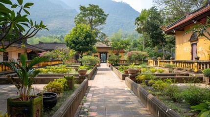 Fototapeta premium Tranquil Temple Garden Surrounded by Lush Mountains and Vibrant Flora