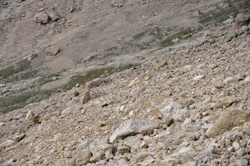A perfect view of the harsh rocks and green plains from the peak of Shahdag in the Caucasus Mountains