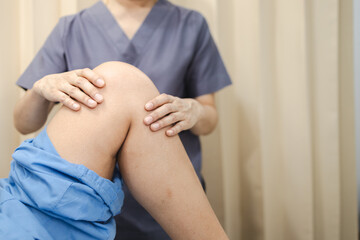 Physical therapy, healthcare professional provides physical therapy by gently examining patient knee, focusing recovery and rehabilitation. This interaction emphasizes importance of physical