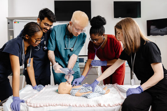 Medical Students Practicing Intubation Technique on Baby Mannequin during Training