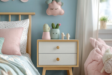 Little girl sitting in a cozy and well-decorated bedroom