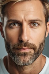 Fototapeta premium arafed man with a beard and a white shirt looking at the camera