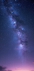 Obraz premium Night sky with the Milky Way galaxy and countless stars, transitioning into a bright twilight purple and pink horizon. A perfect nature phone wallpaper. Ai generative