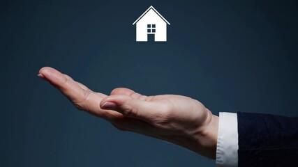 The Hand Holding House Symbol