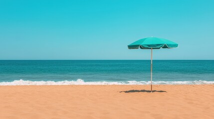 Fototapeta premium Serene beach scene with turquoise umbrella on golden sand under clear blue sky and calm ocean waves