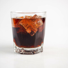 Cola with Ice Cubes on a White Background | Refreshing Cola Drink.