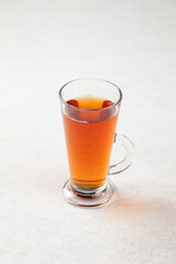 Glass mug of hot black tea