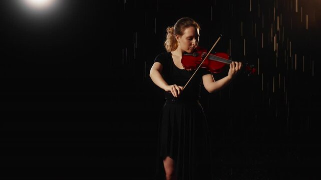 Beautiful young female student of musical school playing violin in night rain. Romantic classical music, talent and inspiration, silhouette of graceful lady with viola in darkness, listening to music