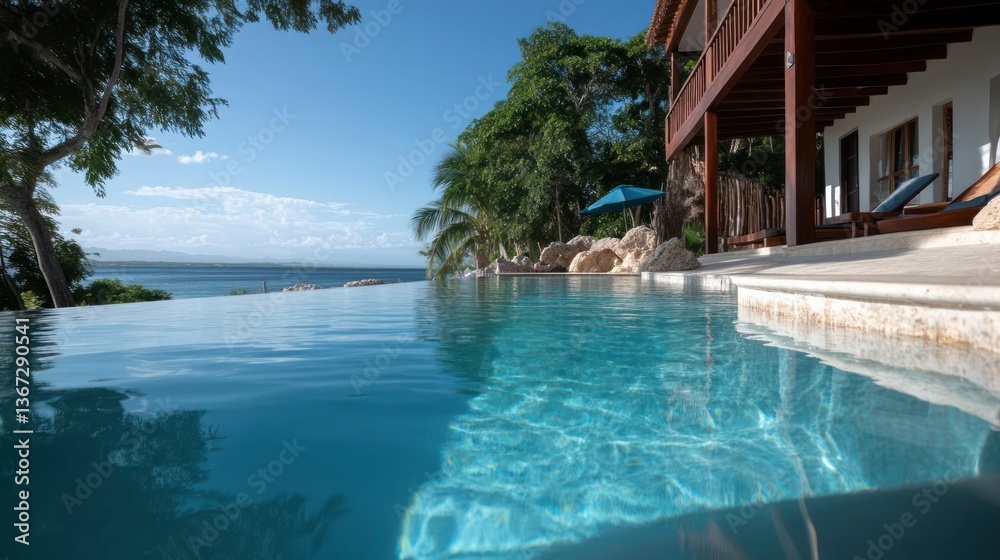 Poster an infinity pool overlooking a calm ocean with clear sky trees and a house with wooden balconies cre
