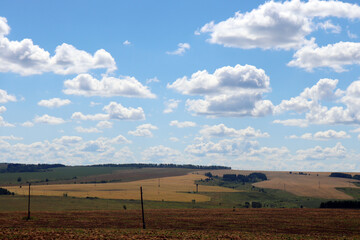 beautiful landscape with clouds and sky. farm fields on the hills landscape. 