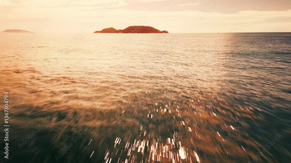 Aufkleber low altitude flight over the sea towards the remote island. camera flights fast over the ocean's sur