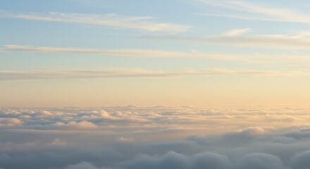 Obraz premium Aerial View of Cloudscape with Soft Golden Light and Blue Sky Above