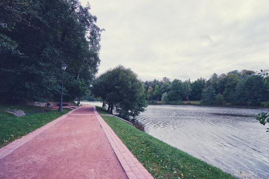 Peaceful Park Trail Along a Scenic Riverside Path..