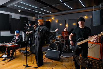 Musicians Performing In a Studio Setting During a Live Rehearsal..