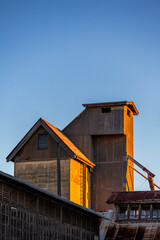 Late afternoon light shining through an abandoned and neglected factory