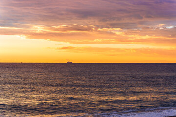 scenic view at beautiful morning beach coastline with orange sand, blue sea water of gulf and beautiful cloudy sky. Nature landscape of wallpaper and backgeound