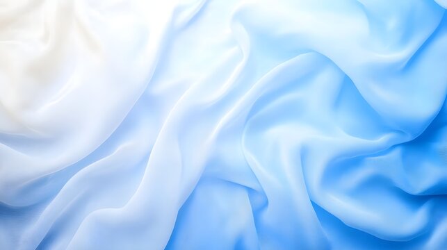 Soft silky blue and white fabric with a gentle flowing wave like pattern creating an elegant and serene abstract composition
