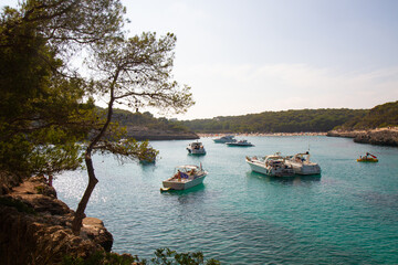 beautiful ships and boats are moored near the shore