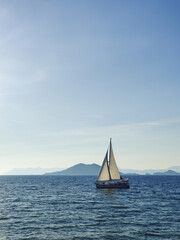 Naklejka premium a beautiful ship is sailing in the blue sea