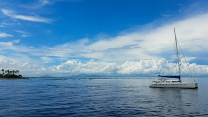 a beautiful ship is sailing in the blue sea