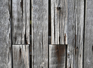 Weathered wooden fence showcases rustic charm and age in an outdoor setting