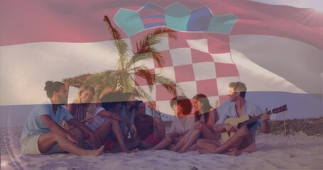 Sitting on beach, group of friends with Croatian flag animation overlay - Powered by Adobe