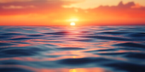 Fototapeta premium a close up of water with the sun setting behind it