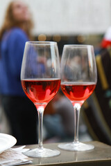 two glasses with red wine on the festive table
