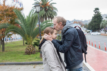 Outdoors portrait of Father and daughter together. Happy family