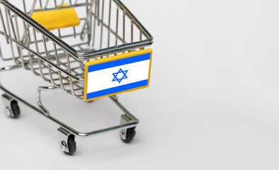 Shopping, VAT and retail in Israel concept. Shopping Cart with Israeli flag on white background