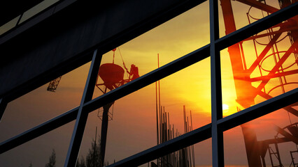 group of construction worker worked late . the construction frame  picture reflection on glass of the square window building exterior design geometric shape