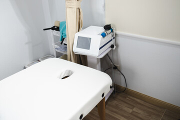 clean therapy room featuring massage table and physical therapy equipment designed for patient comfort and recovery