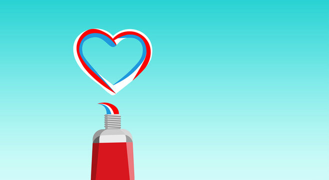 Tube of toothpaste with squeezed out striped multicolored toothpaste for dental care in the shape of a heart on a blue background. Copy space.