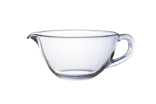 Clear glass measuring cup resting on a reflective surface in a well-lit kitchen environment isolated on transparent background