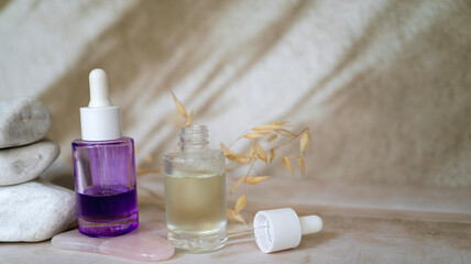 Bakuchiol face serum in a glass bottle on shadows background 