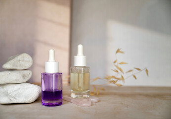 Bakuchiol face serum in a glass bottle on shadows background 