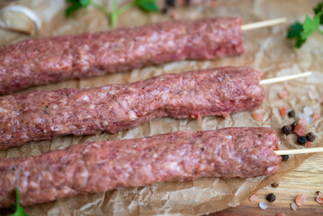 Raw Turkish adana shish kebab skewers