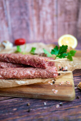 Raw Turkish adana shish kebab skewers