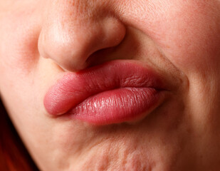 Obraz premium A woman with a red face and a red lip