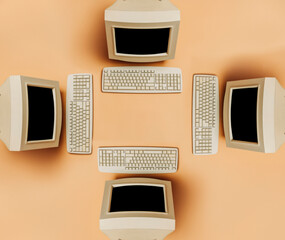 four Vintage PC on brown background, top view. Monitor and keyboard as in 90s