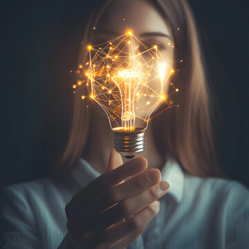The Role of Artificial Intelligence in Education: Creative Solutions to Transform Learning Experiences, hand holding light bulb