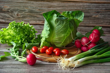 Healthy vegetables on wooden background